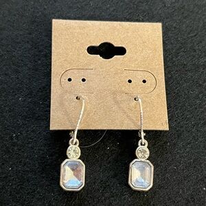 Clear glass stones the center has a blue tint and maybe silver not marked.